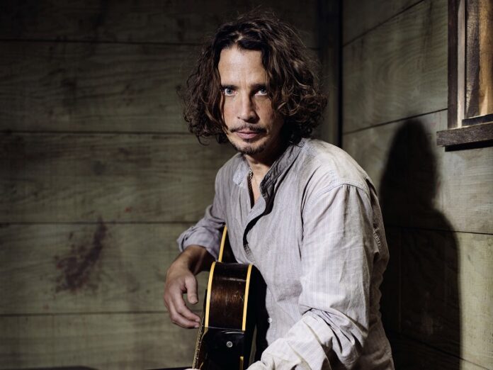 Chris Cornell plays guitar during a portrait session at The Paramount Ranch in 2015 in Agoura Hills, California. Photo: Casey Curry / Associated Press