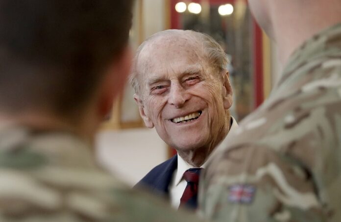 Britain's Prince Philip, in his capacity of Colonel, Grenadier Guards, chats to Sergeants from 1st Battalion Grenadier Guards in their Mess at Lille Barracks last month in Aldershot, England. Photo: Matt Dunham / Associated Press