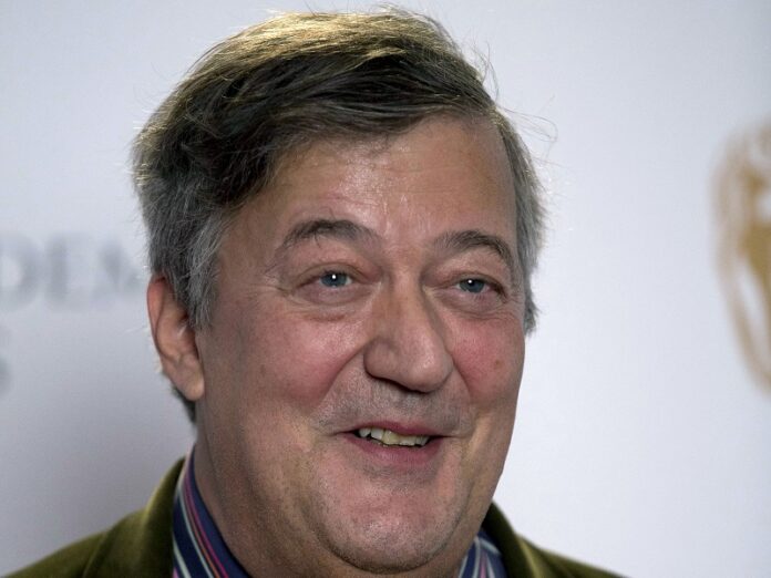 British actor and comedian Stephen Fry poses for photographers during a photocall to mark the announcement of the BAFTA (British Academy of Film and Television Arts) award nominations in 2015 in London. Photo: Matt Dunham / Associated Press