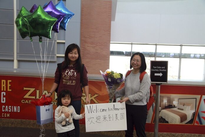 Chen Guiqiu, right, holds a