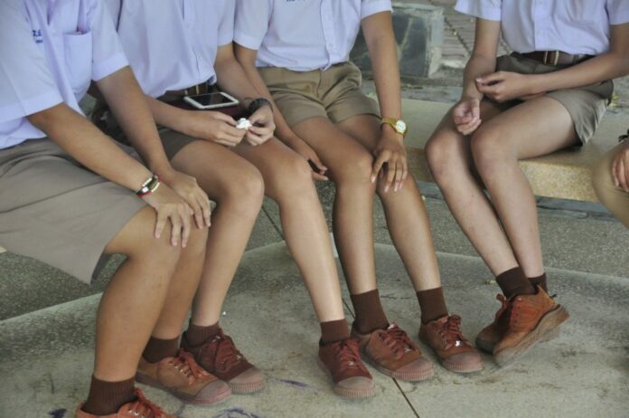 A group of transgender students at Ratchasima Witthayalai School talk to reporters Friday