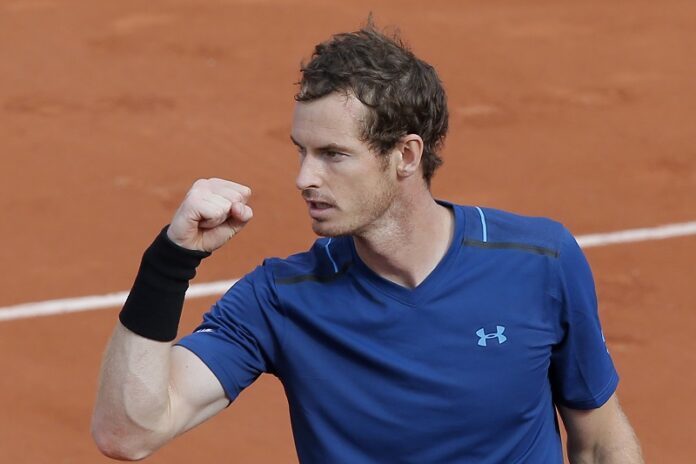Britain's Andy Murray celebrates winning his first round match against Russia's Andrey Kuznetsov in four sets 6-4, 4-6, 6-2, 6-0, Tuesday at the French Open tennis tournament at the Roland Garros stadium, in Paris, France. Photo: Michel Euler / Associated Press