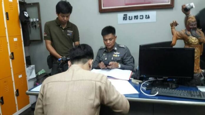 Jaran Naetawan, 26, a GrabCar driver Friday at the Chiang Mai City Police Station.