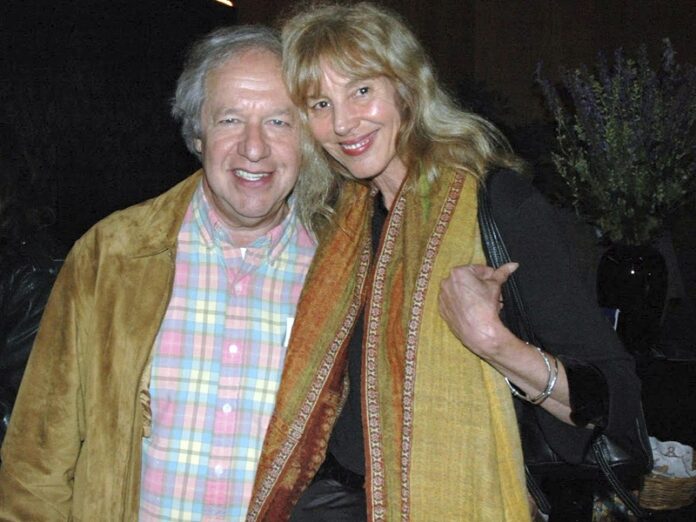 This undated photo provided by Lorenzo Hagerty shows Nicholas Sand and his partner, Gina
