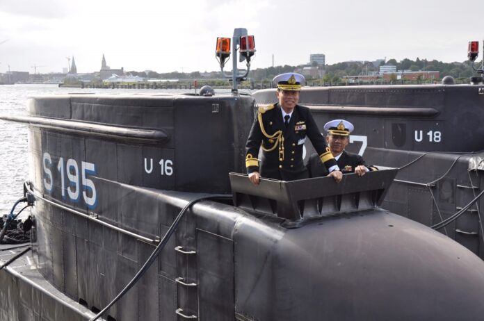 Adm. Suriya Pornsuriya stands atop the observation deck of a German submarine during a 2011 visit to Germany. Thailand ended up scuttling a deal to acquire German subs. Photo: Courtesy