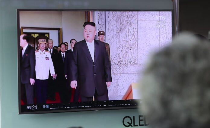 A woman watches a TV screen showing a file footage of North Korean leader Kim Jong Un, Monday at Seoul Train Station in Seoul, South Korea. Photo: Lee Jin-man / Associated Press