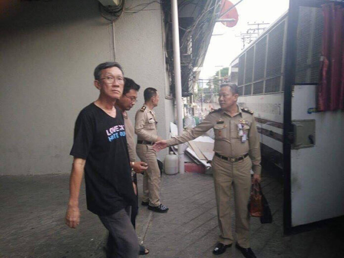 Prawet Prapanukul, a 57-year-old human rights lawyer, is led May 3 from a Bangkok court room and returned to custody. Photo: Matichon