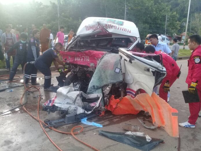 Emergency responders examine a van wrecked in a collision in June 2017 in Sa Kaeo province that killed five.