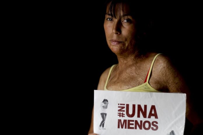 Maira Maidana poses for a portrait with the name of the women's movement