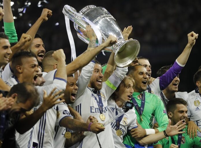 Real Madrid captain Sergio Ramos raises the trophy after the Champions League final soccer match between Juventus and Real Madrid on Saturday at the Millennium stadium in Cardiff, Wales. Photo: Frank Augstein / Associated Press