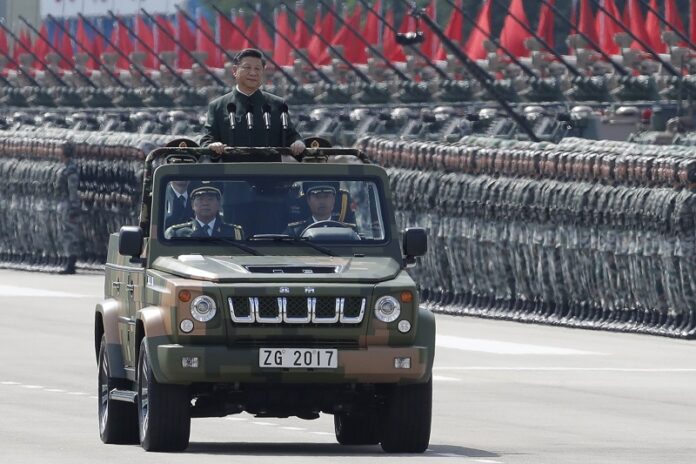 Chinese President Xi Jinping inspects the People's Liberation Army of the Hong Kong Garrison at the Shek Kong Barracks on Friday in Hong Kong. Photo: Kin Cheung / Associated Press