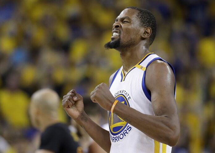 Golden State Warriors forward Kevin Durant reacts after scoring against the Cleveland Cavaliers during the second half of Game 5 of basketball's NBA Finals Monday in Oakland, California. Photo: Marcio Jose Sanchez / Associated Press