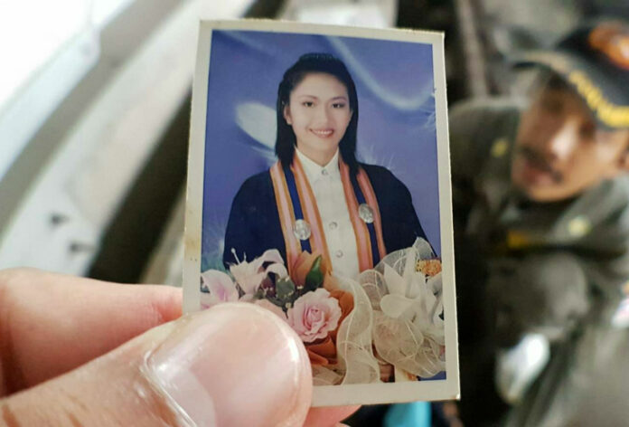 Rossarin Plianla, 30, in an image held over the scene of her death Monday at Airport Rail Link Ban Thap Chang.