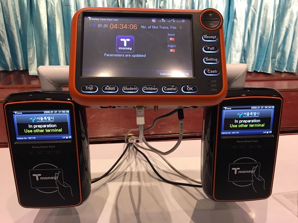 A prototype Mangmoom card reader is displayed Thursday.