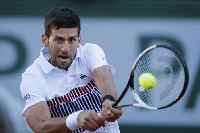 Serbia's Novak Djokovic plays a shot in his fourth round match against Spain's Albert Ramos-Vinolas at the French Open tennis tournament Sunday at the Roland Garros stadium, in Paris, France. Photo: Christophe Ena / Associated Press