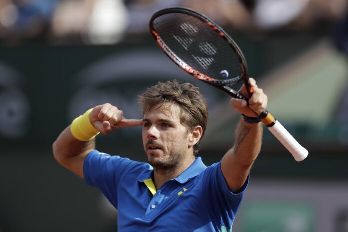 Switzerland's Stan Wawrinka celebrates winning his fourth round match of the French Open tennis tournament against France's Gael Monfils in three sets 7-5, 7-6 (9-7), 6-2, Monday at the Roland Garros stadium, in Paris, France. Photo: Petr David Josek / Associated Press