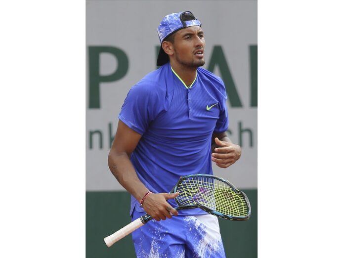 Australia's Nick Kyrgios breaks his racket in his second round match against South Africa's Kevin Anderson on Thursday at the French Open tennis tournament at the Roland Garros stadium, in Paris, France. Photo: David Vincent / Associated Press