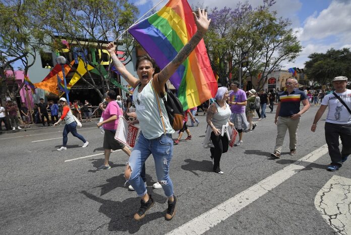 A marcher mugs for the camera during the Los Angeles LGBTQ #ResistMarch, Sunday in West Hollywood, California. Photo: Mark J. Terrill / Associated Press