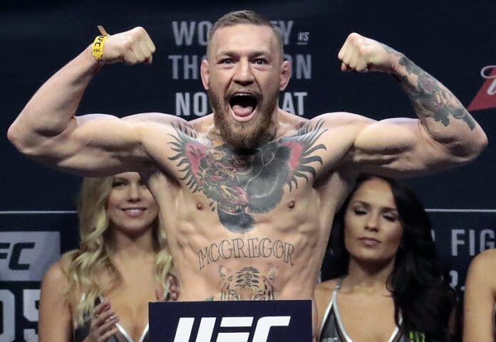 Conor McGregor stands on a scale during the weigh-in event for his fight against Eddie Alvarez in UFC 205 mixed martial arts last November at Madison Square Garden in New York. Photo: Julio Cortez / Associated Press