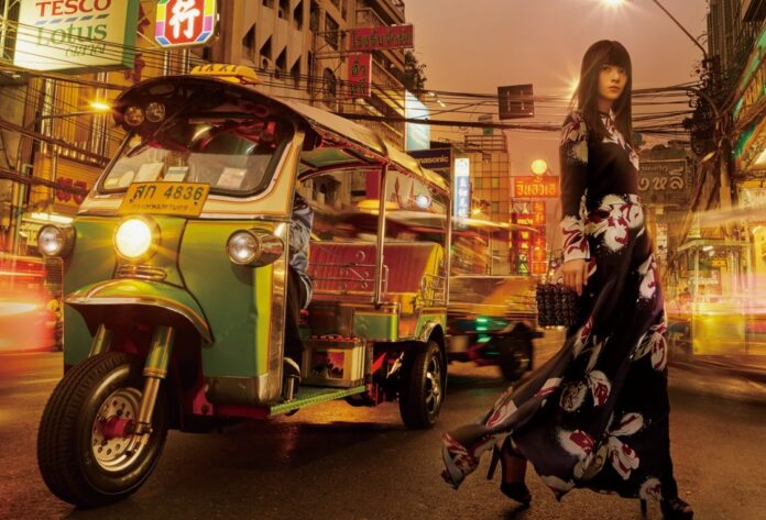 A promotional image from Tourism Authority of Thailand featuring a member of Nogizaka46 girl group.