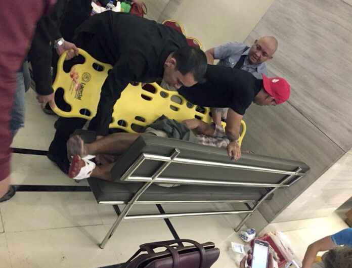 An injured man is placed on a stretcher after explosions rang out in June at the Resorts World Manila complex near Manila's international airport in the Philippine capital, sparking a security alarm amid an ongoing Muslim militant siege in the country's south. Photo: Tikos Low / Associated Press