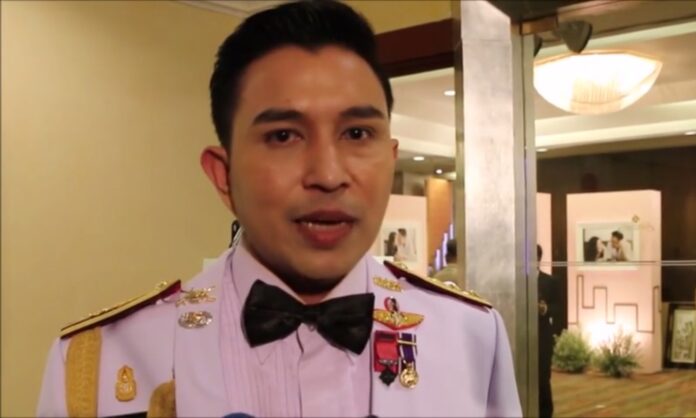 Lt. Col. Phitakphon Chusri speaks to a reporter at his wedding reception Thursday night in Khon Kaen province