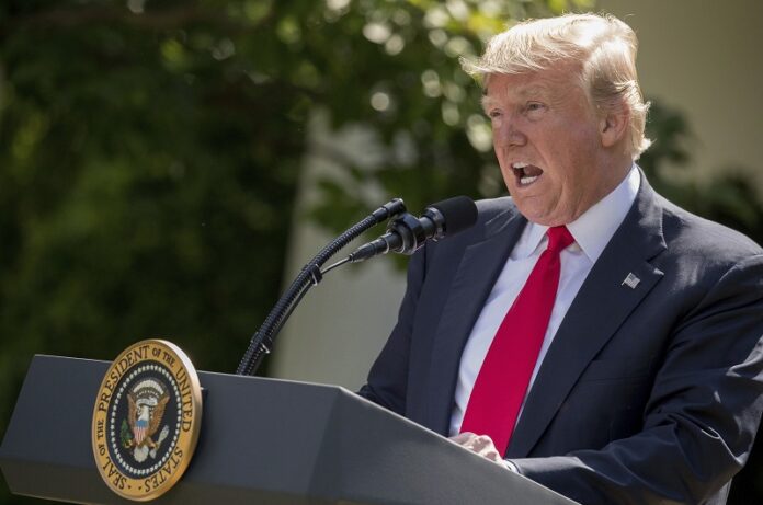 President Donald Trump speaks about the U.S. role in the Paris climate change accord, Thursday in the Rose Garden of the White House in Washington. Photo: Andrew Harnik / Associated Press