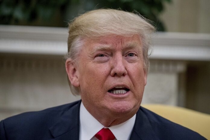 President Donald Trump speaks in the Oval Office on Wednesday at the White House in Washington. Photo: Andrew Harnik / Associated Press