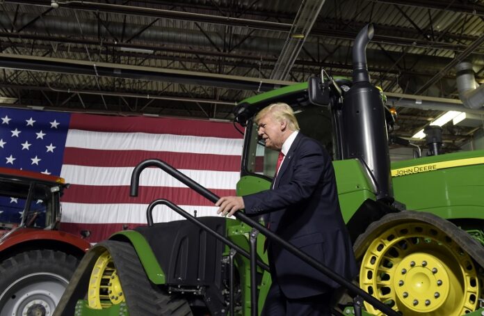 President Donald Trump walks on stage to speaks at Kirkwood Community College, which is recognized by the White House as a major center of agricultural innovation, during a visit to the campus Wednesday in Cedar Rapids, Iowa: Photo: Susan Walsh / Associated Press