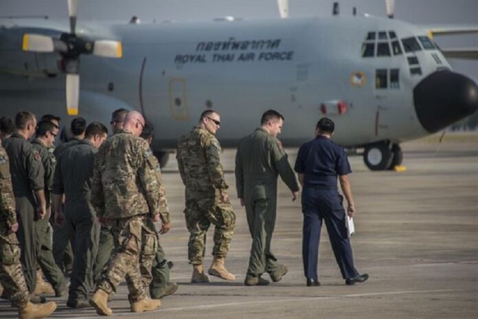 U.S. Air Force personnel conduct a foreign object debris walk with the Royal Thai Air Force 601st Squadron on March 2 at Don Mueang Air Base. Various accounts have placed a