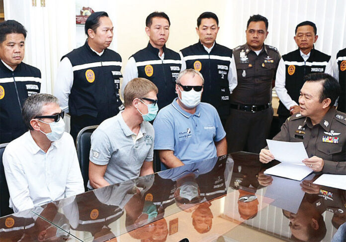 Police question three Russian men arrested March 21 on suspicion of overstaying their visas and extorting Thai businesses in Pattaya