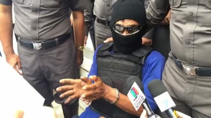 Wichai Chotisena, 58, describes Thursday how he raped and killed an 11-year-old schoolgirl.