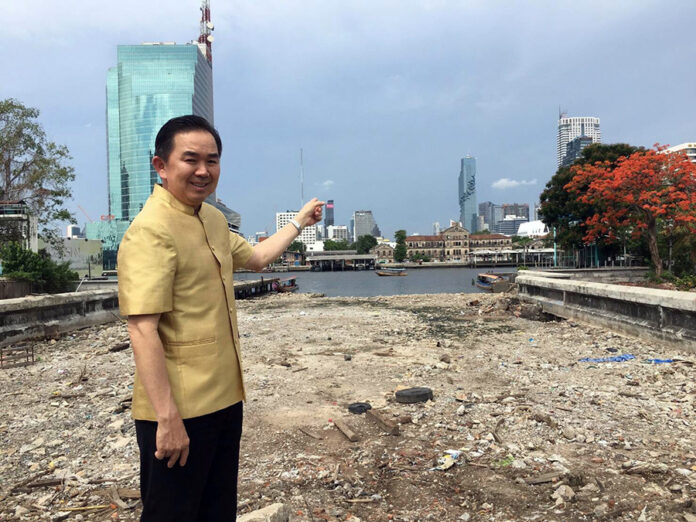 In a May 31, 2016, file photo, Chakkrit Parapuntakul, then-director of the Treasury Department, points to a plot of land where the Bangkok Observation Tower will be built. Image: Ministry of Finance