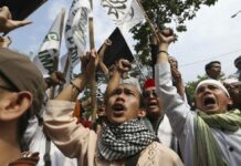 Indonesia’s Main Muslim Group Criticizes Blasphemy Sentence Muslim protesters shout slogans at a rally against Jakarta's Christian governor who was convicted of blasphemy in May 2017. Photo: Achmad Ibrahim / Associated Press