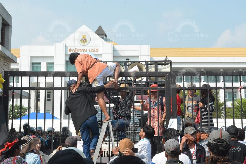 Enraged at the commission's alleged favoritism, Redshirt activists on Feb. 28, 2014, attempt to break into the NACC headquarters in Bangkok.