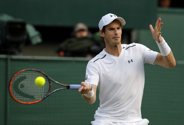 Britain's Andy Murray returns to Italy's Fabio Fognini during their Men's Singles Match on day five at the Wimbledon Tennis Championships on Friday in London. Photo: Alastair Grant / Associated Press