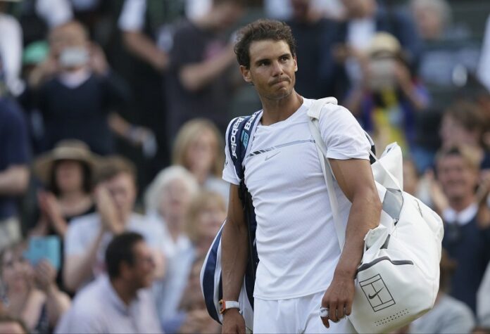 Spain's Rafael Nadal leaves the court after losing to Luxembourg's Gilles Muller after their Men's Singles Match on day seven at the Wimbledon Tennis Championships on Monday in London. Photo: Tim Ireland / Associated Press