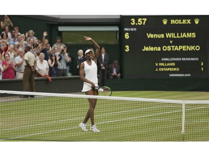 Venus Williams of the United States celebrates after beating Latvia's Jelena Ostapenko at the end of their Women's Quarterfinal Singles Match on day eight at the Wimbledon Tennis Championships on Tuesday in London. Photo: Tim Ireland / Associated Press