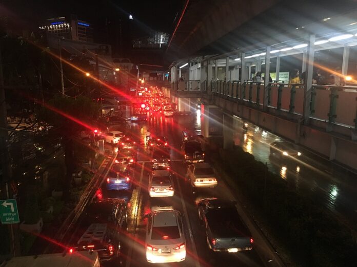 A traffic-clogged, rain-soaked road Friday near BTS Ekkamai.