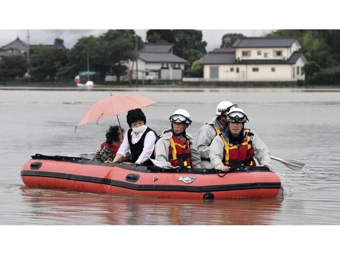 Residents are rescued by boat after heavy rain isolated an area Thursday in Asakura, Fukuoka prefecture, southwestern Japan. Sadayuki Goto / Associated Press