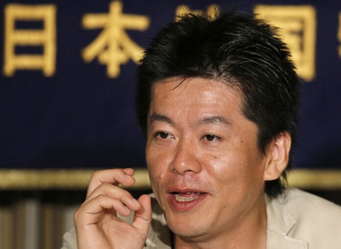 A 2013 photo file of Takafumi Horie, the Japanese dot.com celebrity imprisoned for nearly two years on securities fraud charges, speaks during a press conference at the Foreign Correspondents' Club of Japan in Tokyo. Photo: Shuji Kajiyama / Associated Press