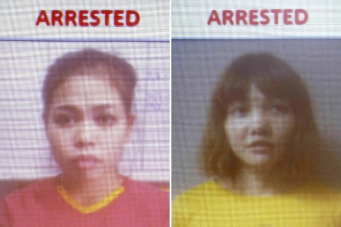 This combination of Feb. 19, 2017, photos released by Royal Malaysia Police shows detained Indonesian suspect Siti Aisyah, left, and detained Vietnamese suspect Doan Thi Huong on a screen during a press conference at national police headquarters in Kuala Lumpur, Malaysia. Photo: Royal Malaysia Police via AP