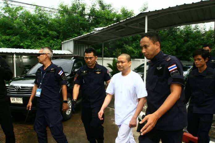 Wirapol Sukphol is taken Thursday morning to the Attorney General’s Office in Bangkok.