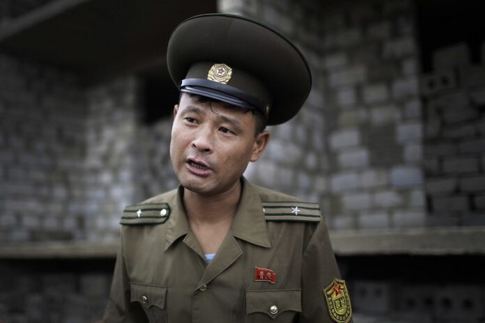 Maj. Jong Il Hyon, 44, a member of a bomb squad for South Hamgyong, speaks to The Associated Press in February at a construction site on the outskirts of Hamhung, North Korea's second-largest city, where workers unearthed a rusted but still potentially deadly mortar round. Photo: Wong Maye-E / Associated Press