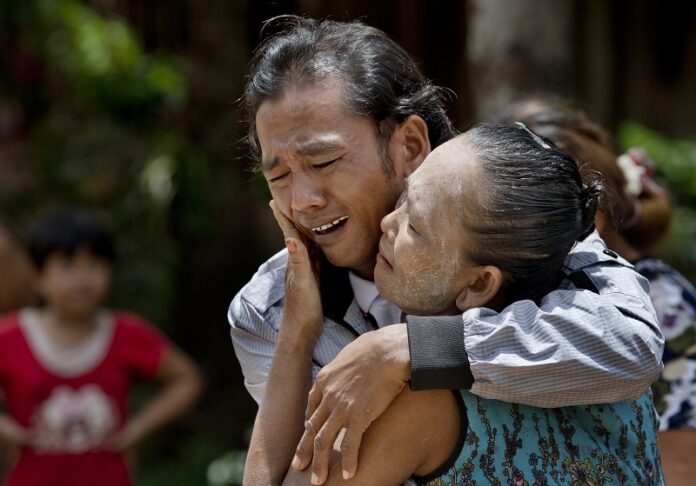 Former slave fisherman Myint Naing and his mother, Khin Than, cry as they are reunited May 16, 2015, after 22 years at their village in Mon State, Myanmar. Photo: Gemunu Amarasinghe / Associated Press