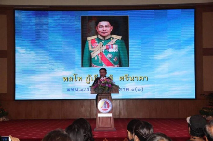 1st Army Corps commander Lt. Gen. Kukiat Srinaka stands below a large image of himself Monday at the 1st Army Division headquarters in Bangkok. Photo: Prachachart
