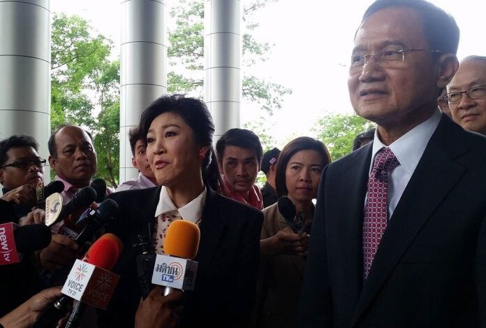 Yingluck Shinawatra and Somchai Wongsawat, at right, attend a court hearing in Bangkok on June 1, 2016.