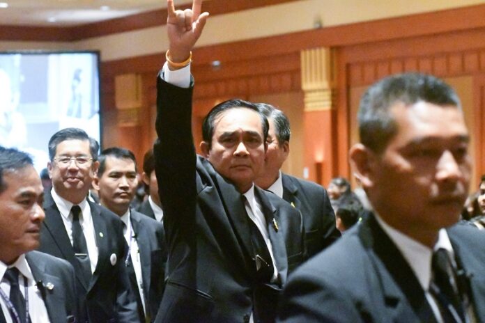 Prime Minister Prayuth Chan-ocha says ‘I love you’ in sign language last August at the Thailand Labour Management Excellence Awards event in Nonthaburi province.