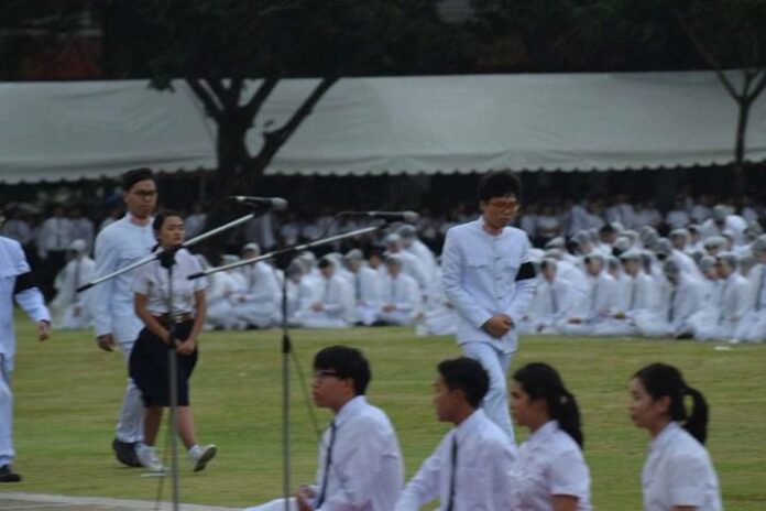 Netiwit Chotiphatphaisal, standing at right, walks off the central field Thursday on the campus of Chulalongkorn University. Photo: Netiwit Chotiphatchaisal