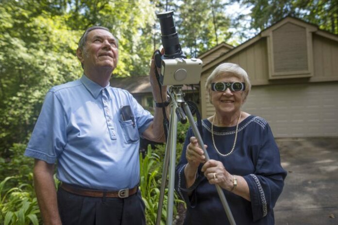 Donald and Norma Liebenberg stand in the driveway of their home in Salem, South Carolina, on Thursday. Donald has seen and blogged about his 26 eclipses for Clemson University where he does research, and holds the record for most time in totality because the retired federal scientist used to chase them by airplane whenever possible. In 2017, the celestial event will come to him. Photo: Ken Scar / Clemson University